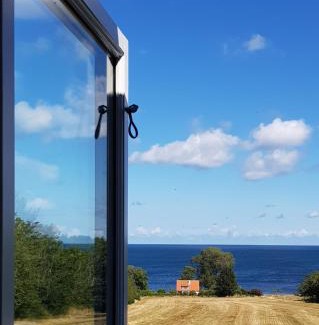 Gudhjem Apartment | Guest Rated Pyttegården Apartments with Oceanfront Views