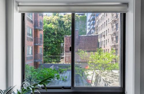 Midtown South Apartment | Charming Chelsea 1BR with Doorman, Gym & Balcony in NYC