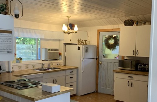 Christina Lake Cottage | Enchanting Lakefront Cottage with Deck, Hot Tub & Yard