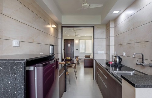 Rajkot Apartment | Discover Patria Suites: Guest Rated 9.2 with Pool & Spa