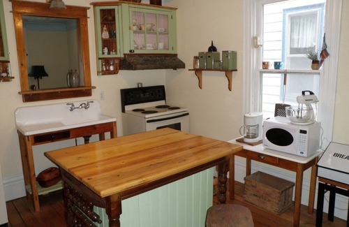 Wellington House | Charming Queen Anne Victorian Cottage in Wellington's Heart