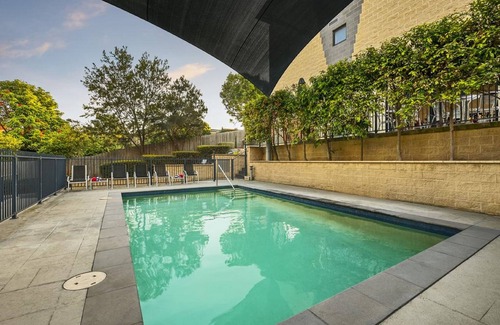 Frankston Apartment | Relaxing Quest Frankston: Poolside Ocean Views Await