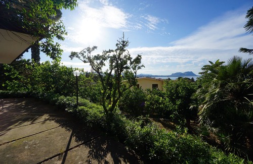 Torre Colonna-sperone Villa | Tranquil Oceanfront Apartment with Garden Near the Sea