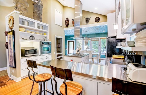 East Cesar Chavez House | Tranquil Central Retreat with Yard, Deck & Pool Amenities