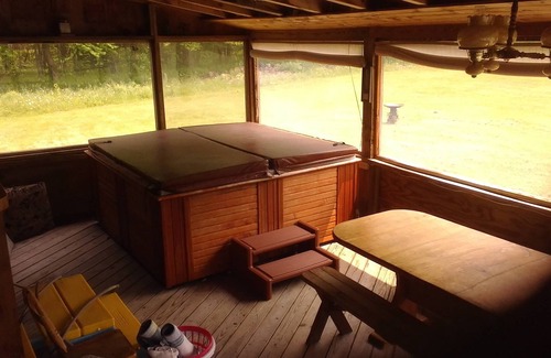 Parish House | Tranquil Log Home with Scenic Ponds and Spa Amenities