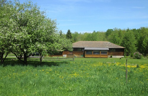 Parish House | Tranquil Log Home with Scenic Ponds and Spa Amenities