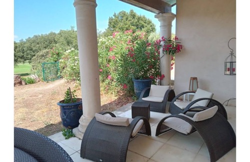 Garrigues Villa | Tranquil Golf Course Retreat Minutes from Town Center