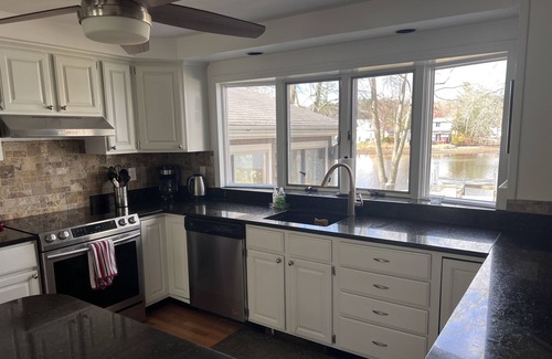 Coventry House | Serene Lakefront Escape with Family-Friendly Amenities
