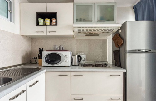 Sukhumvit Apartment | Serene Getaway Near Malls with Pool and Spa Amenities