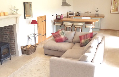 Brimpsfield House | Idyllic 16th Century Cotswold Barn with Panoramic Views