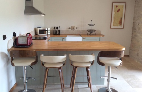 Brimpsfield House | Idyllic 16th Century Cotswold Barn with Panoramic Views