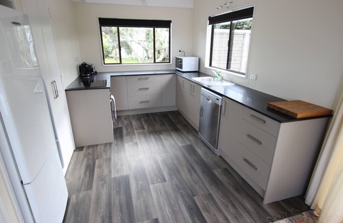 Omaha House | Charming Kiwi Bach with Ocean View and Pet-Friendly Amenities