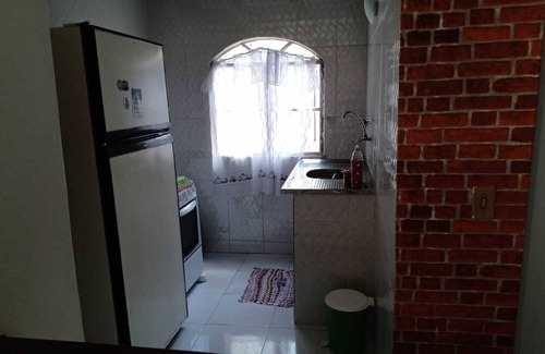 Araruama Apartment | Gaviao Lagoon Kitchenette: Oceanfront Family Retreat