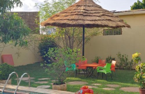 Ouagadougou Villa | Relax at Résidence des Hibiscus-Roses: Pool & Ocean Views