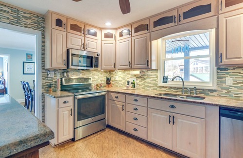 Ingles House | Scenic Lakefront Retreat with Wraparound Deck and Spa