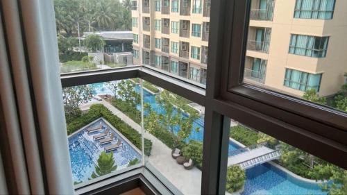 Cha-am Apartment | Relaxing Oceanfront 2-Bedroom at Rain Condo by Leelawadee