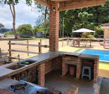 Kampung Padang Jambu Cabin | Charming Rajawali Riverside Retreat with Oceanfront Pool