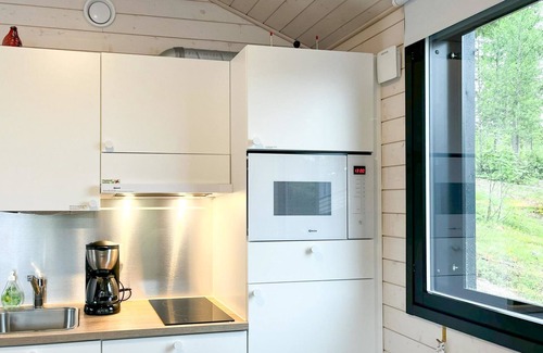 Kehys-Kainuu House | Rakkaranta: Scenic Lake View with Spa and Family Amenities