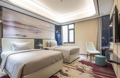 Honghe Hotel | Budget-Friendly Ramada by Wyndham Mengzi Suites Awaits