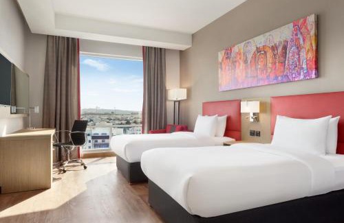 Al Ghubrah Ash Shamaliyyah Hotel | Stylish Ramada Encore: 4-Star Comfort with Ocean Views