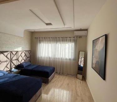Oujda Apartment | Discover Rawan Residency: Family-Friendly with Pool & Dining