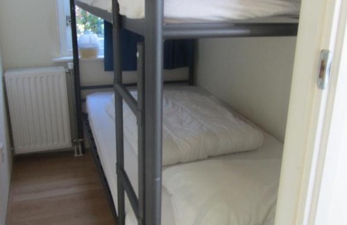 Warmenhuizen Resort | Idyllic Bungalow Steps from the Beach with Ocean Views