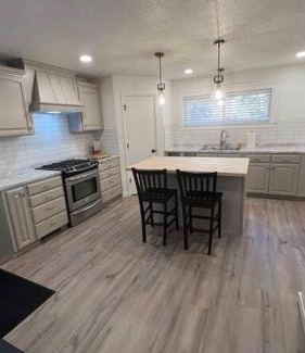 Blackfoot House | Family-Friendly Red Brick Retreat with Guest Rated 9.8