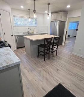 Blackfoot House | Family-Friendly Red Brick Retreat with Guest Rated 9.8