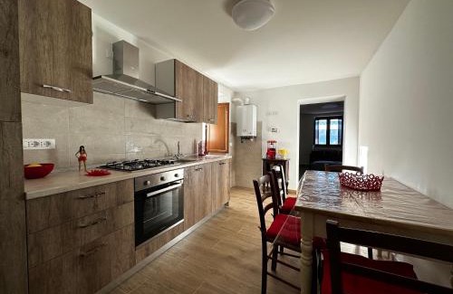 Lucoli House | Inviting Red Cottage-Campo Felice: Pet-Friendly Escape