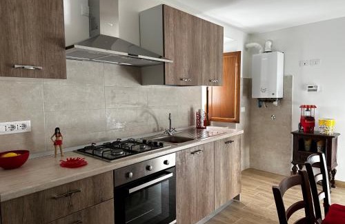 Lucoli House | Inviting Red Cottage-Campo Felice: Pet-Friendly Escape