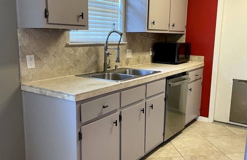 North Northwest Pensacola House | Pet-Friendly Red Door Bungalow - Just 15 Minutes to Beach