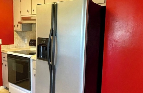 North Northwest Pensacola House | Pet-Friendly Red Door Bungalow - Just 15 Minutes to Beach