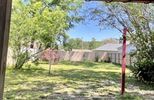 North Northwest Pensacola House | Pet-Friendly Red Door Bungalow - Just 15 Minutes to Beach