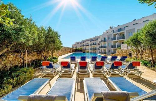 Marsalforn Apartment | Enchanting Red Rose: Oceanfront Haven with Top Ratings