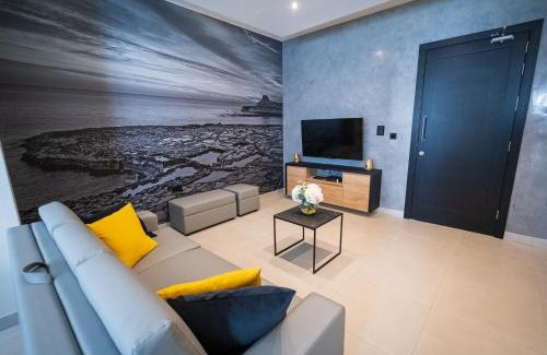 Marsalforn Apartment | Enchanting Red Rose: Oceanfront Haven with Top Ratings