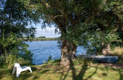 Breiholz House | Charming Oceanfront Stay at Reetdachhaus Eiderblick