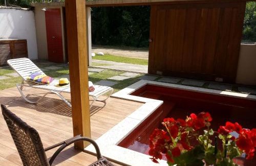 Jabaquara House | Rubi Hotel: Modern Suites with Ocean View & Pool Access
