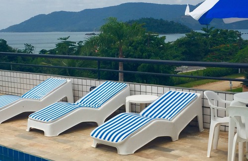 Lagoinha Apartment | Relax at Kendy Flats: Rooftop Pool & Ocean Views Await