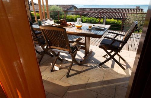 Moniga del Garda Villa | Discover Relax al Porto Gerale: Oceanfront Bliss Awaits