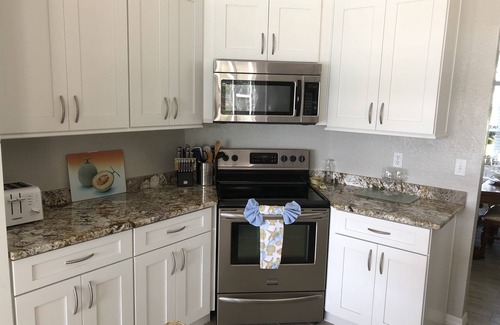 Auburndale House | Experience Southern Exposure: Pool, Lake & Spa Awaits