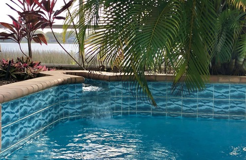 Auburndale House | Experience Southern Exposure: Pool, Lake & Spa Awaits