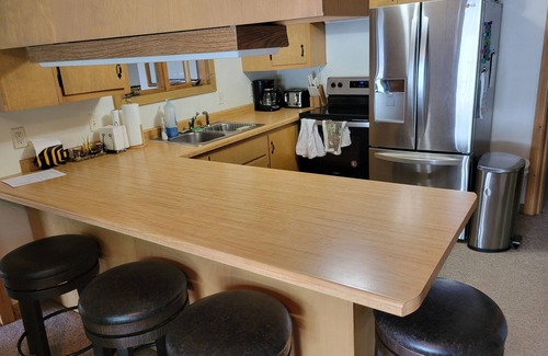 Brazeau House | Serene Lakefront Cabin with Pool & Ocean Views, Rated 10/10