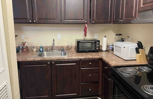 Peachtree Corners Apartment | Family-Friendly Retreat with Pool and Kitchen Amenities