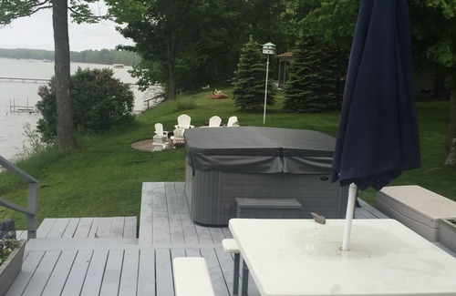Brutus House | Tranquil Burt Lake Cottage with Pool & Scenic Views