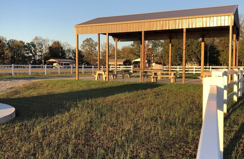 Flatwoods RV Rental | Pet-Friendly Waterfront RV Lot with Scenic River Views