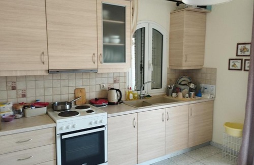 Akraifnion Apartment | Cozy Home Retreat with Family-Friendly Amenities