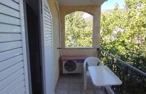 Akraifnion Apartment | Cozy Home Retreat with Family-Friendly Amenities