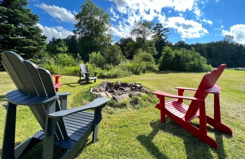 Bancroft House | Tranquil Riverside Retreat with a Welcoming Fireplace