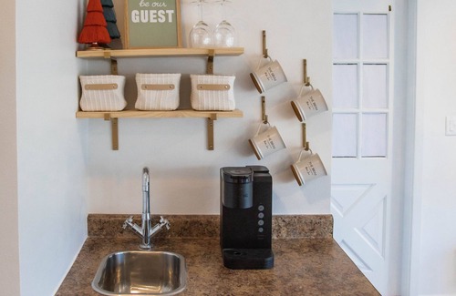 Elkader Apartment | Indulgent Riverfront Suite on Historic Main Street