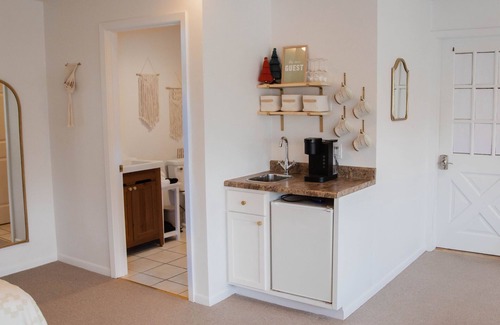 Elkader Apartment | Indulgent Riverfront Suite on Historic Main Street